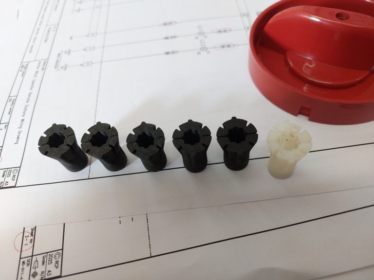 3D Printed Isolator Inserts (black) and Original Isolator Insert (white)